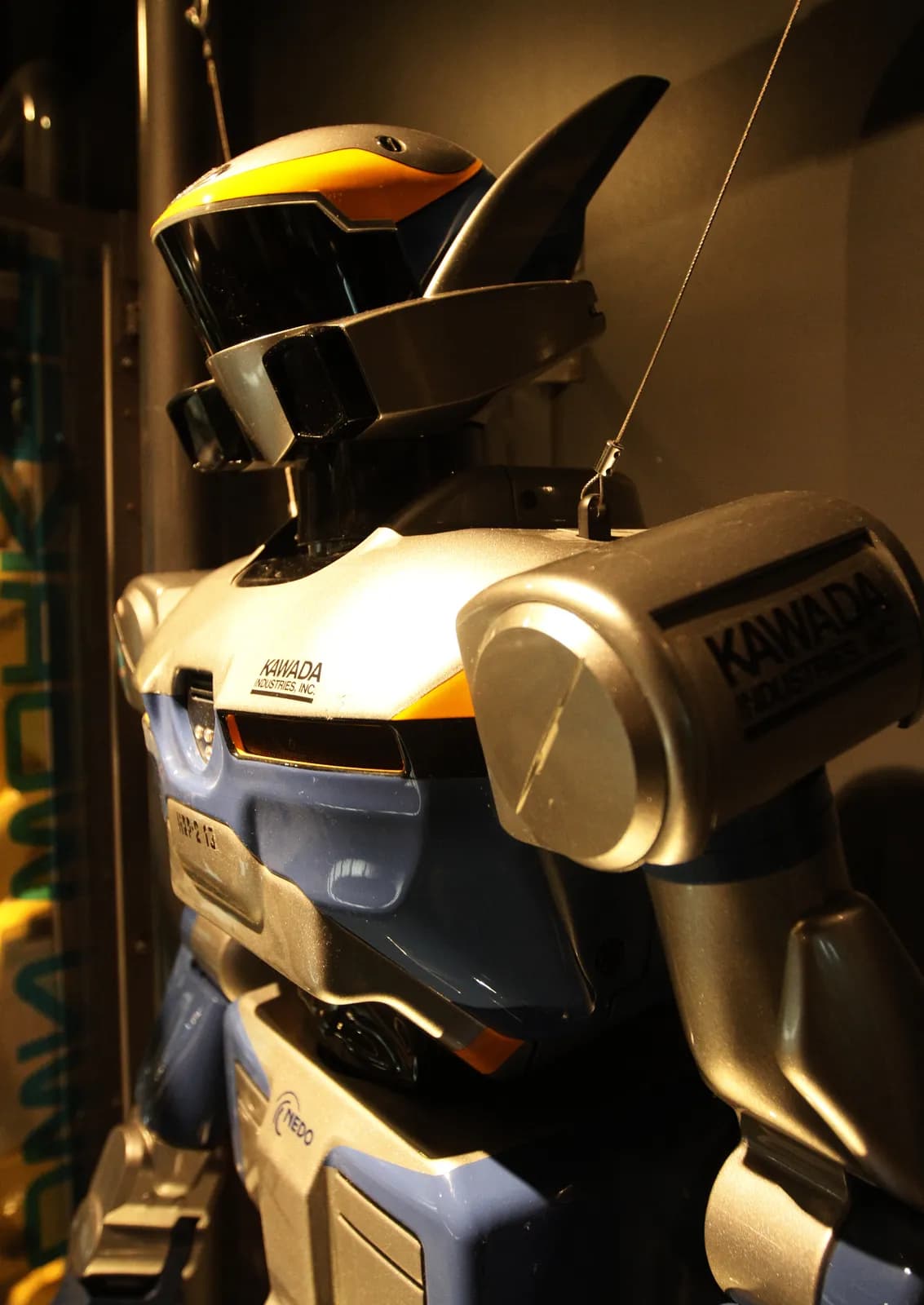 HRP-2 humanoid robot, side view in a display case at the Science Museum, Tokyo
