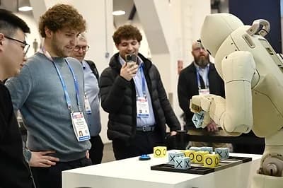 Visitors playing chess with the GR-3 humanoid robot at CES 2026
